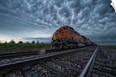 Freight Train With Mammatus Clouds Overhead While On A Storm Chasing Tour, Oklahoma, USA