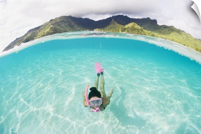 French Polynesia, Moorea, Woman Free Diving In Turquoise Ocean