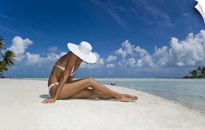 French Polynesia, Tuamotu Islands, Rangiroa Atoll, Woman Sitting On White Sand Beach