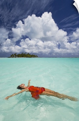 French Polynesia, Woman Floating In Ocean Water