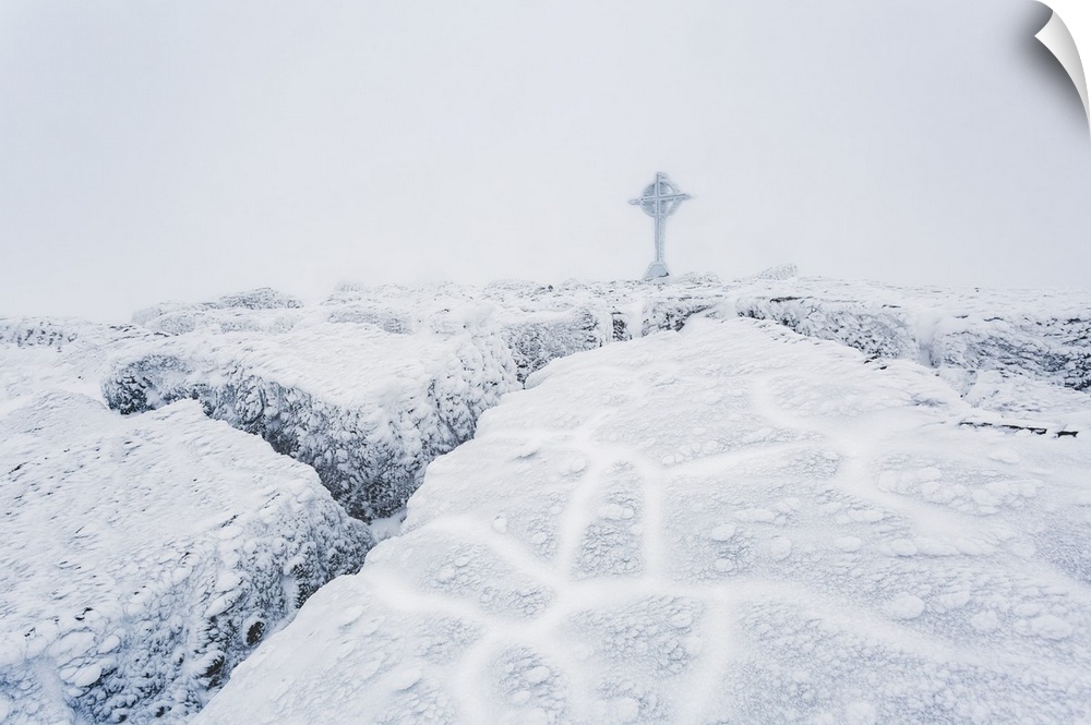Frozen ice formations on the summit of Galtymor mountain with a celtic cross in winter, Galty Mountains; County Tipperary,...