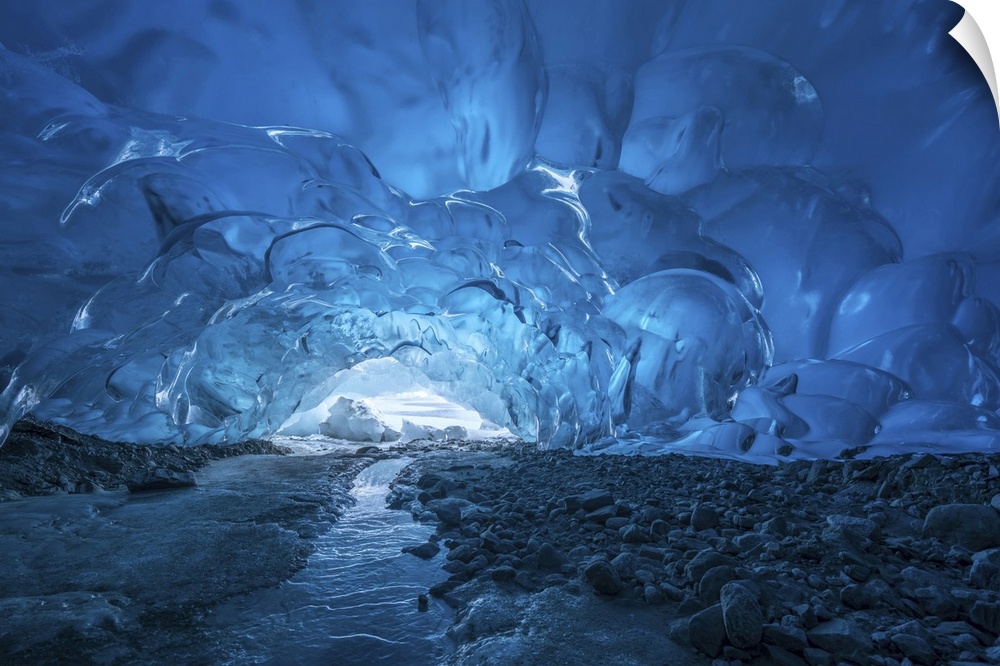 Blue glacial ice is exposed inside an ice cave at the terminus of Mendenhall glacier, Mendenhall Lake, Tongass national fo...