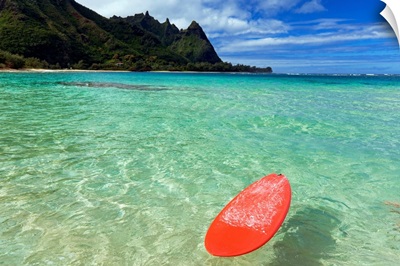 Hawaii, Kauai, Haena Beach, Red Surfboard Floating In Shallow Ocean