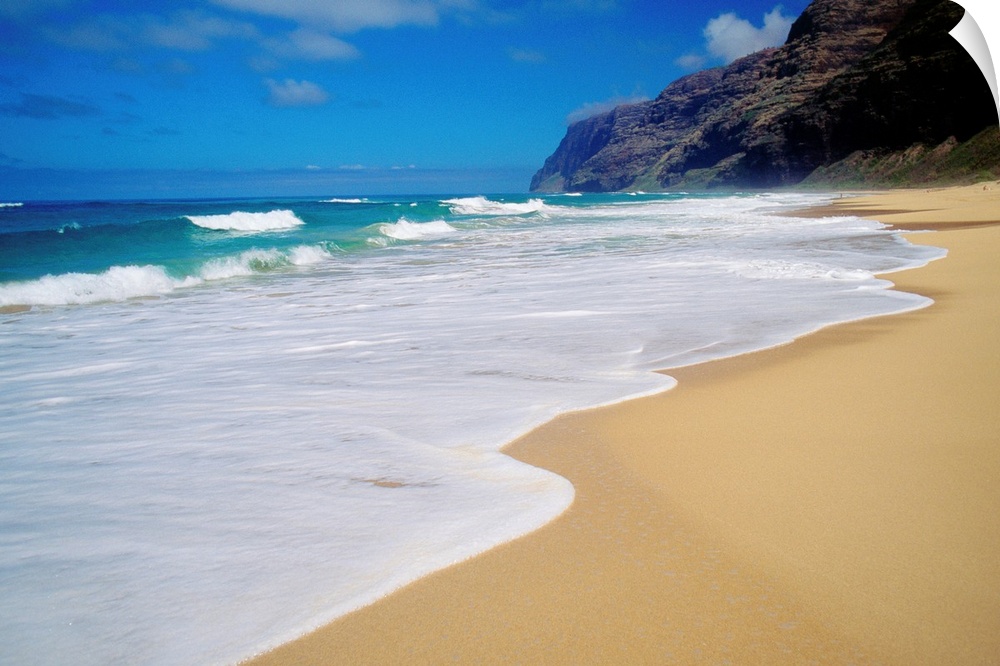 Horizontal, oversized photograph of the shoreline at Polihale Beach in Kauai, Hawaii.  A cliff and the Napali Coast are in...