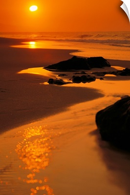 Hawaii, Oahu, North Shore, Beautiful Orange Sunset On Rocky Shoreline