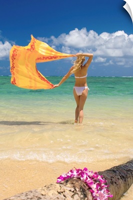 Hawaii, Oahu, Punaluu Beach, Young Woman Standing In Ocean Holding Pareo