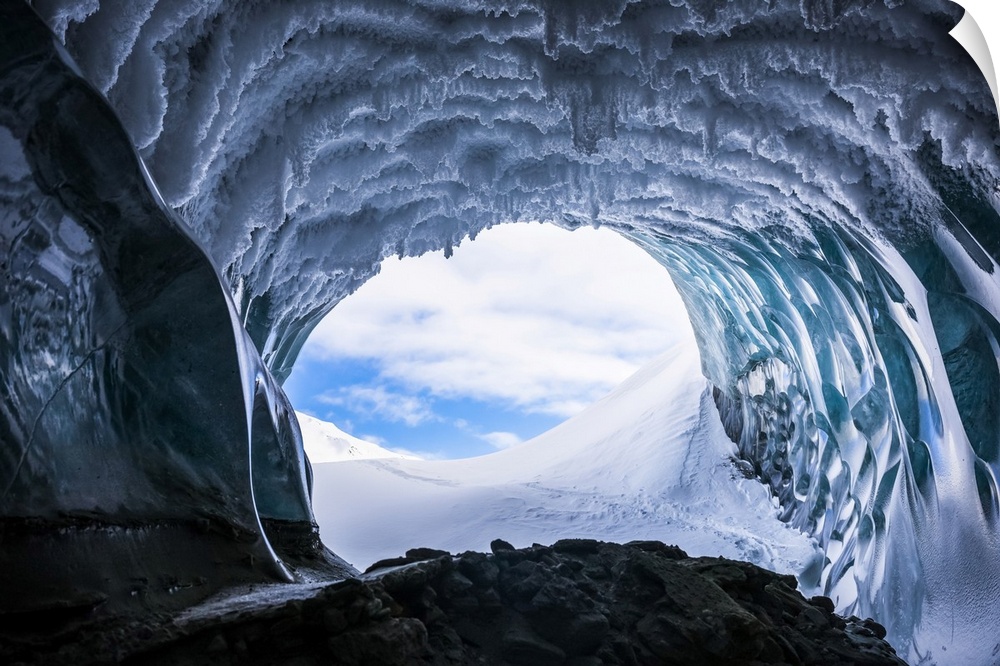 Hoarfrost hangs from the ceiling of a Canwell Glacier ice cave in winter; Alaska, USA