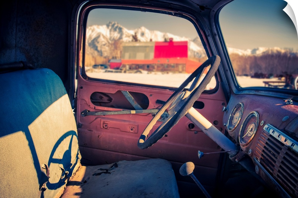 Interior view of a old, worn truck with Pioneer Peak visible out of the automobile window, South-central Alaska; Palmer, A...