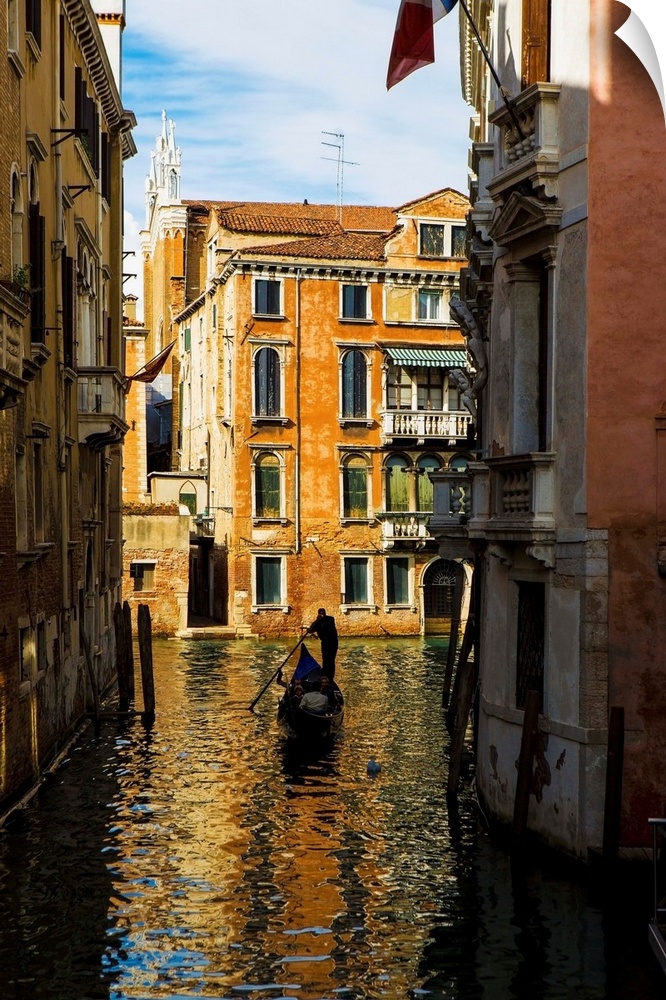Italy, Venice, Rowing gondola through canal