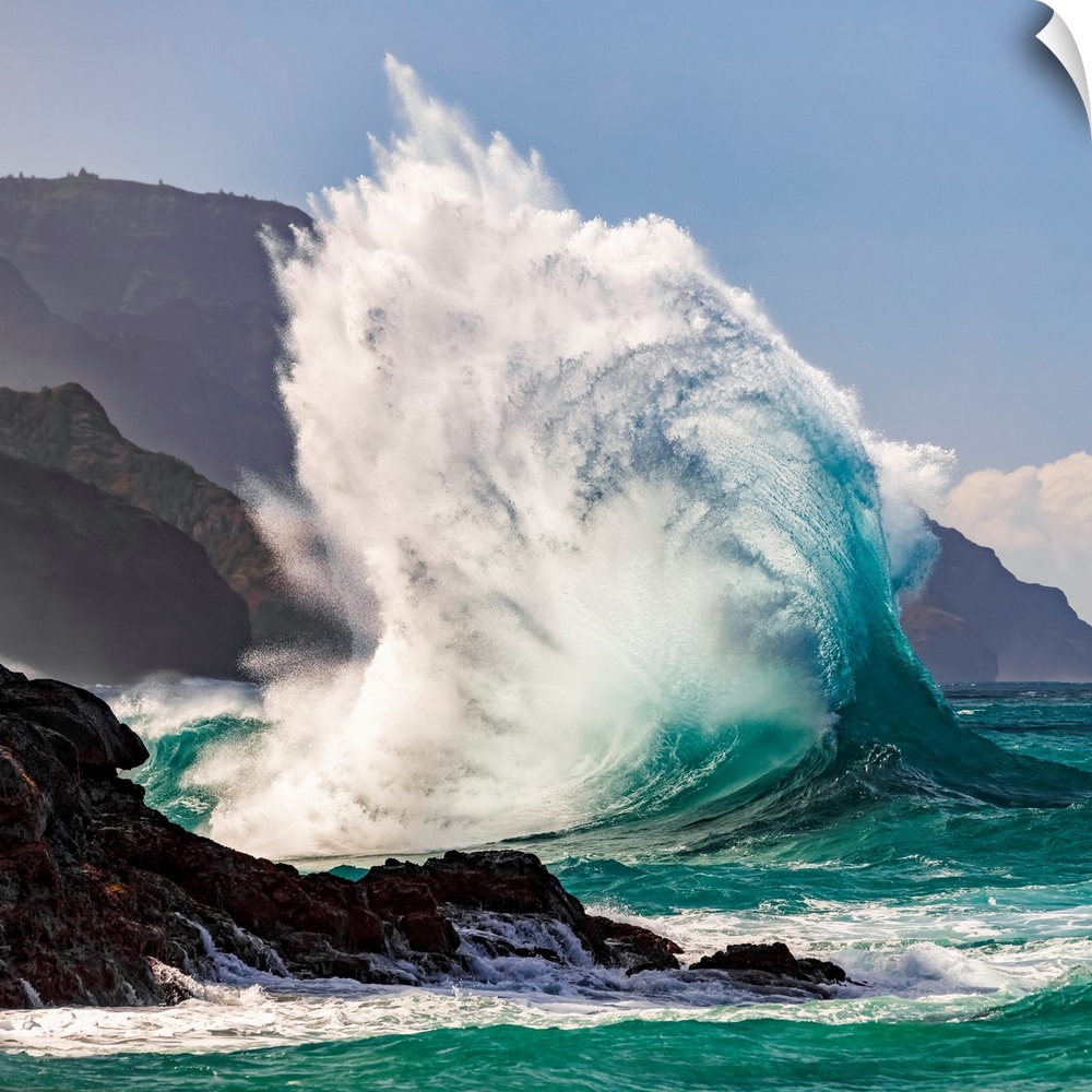 Large ocean wave crashes into rock along the Na Pali coast, Kauai, Hawaii, united states of America.