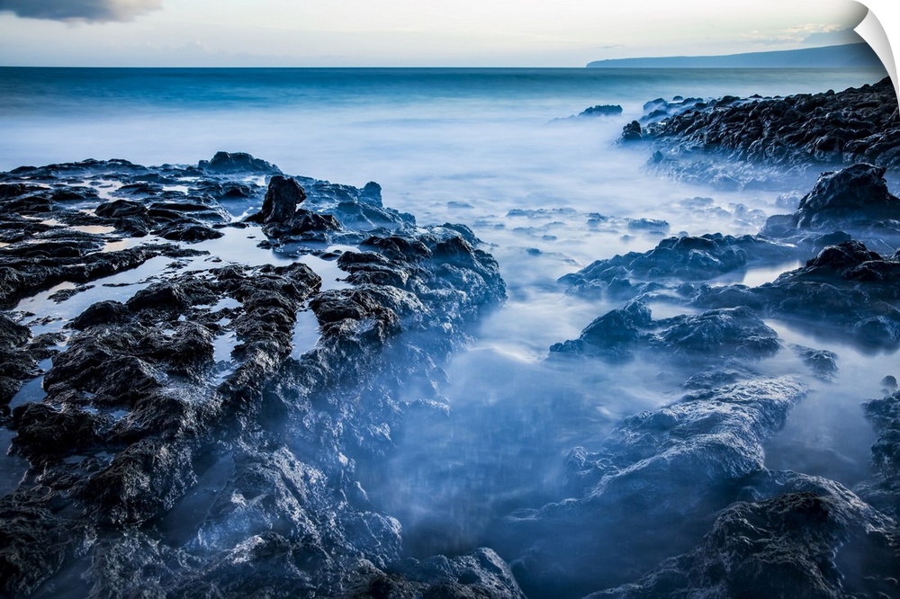 Long exposure of tide pools along the coastline and a view of the Pacific Ocean; Makawao, Maui, Hawaii, United States of A...