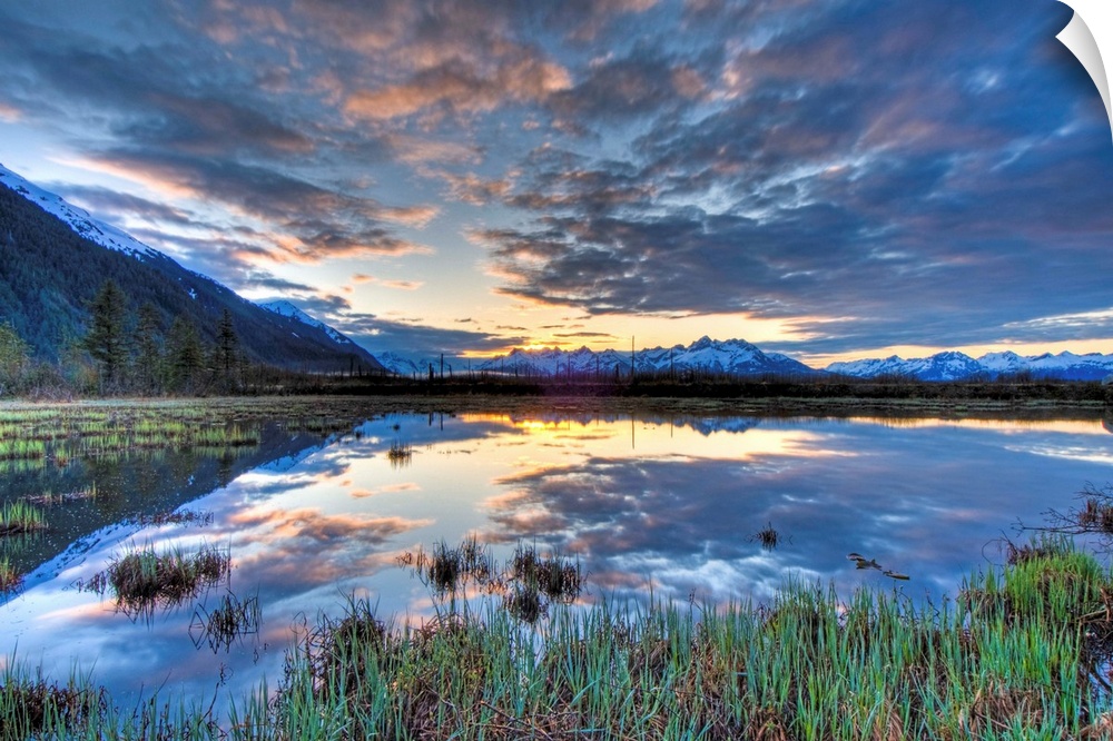 Morning sky reflecting on a pond near the Copper River Highway outside of Cordova.  Four image HDR composite.