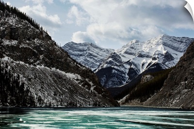 Mountains and frozen lake in winter, Bow Valley Wildland, Alberta, Canada