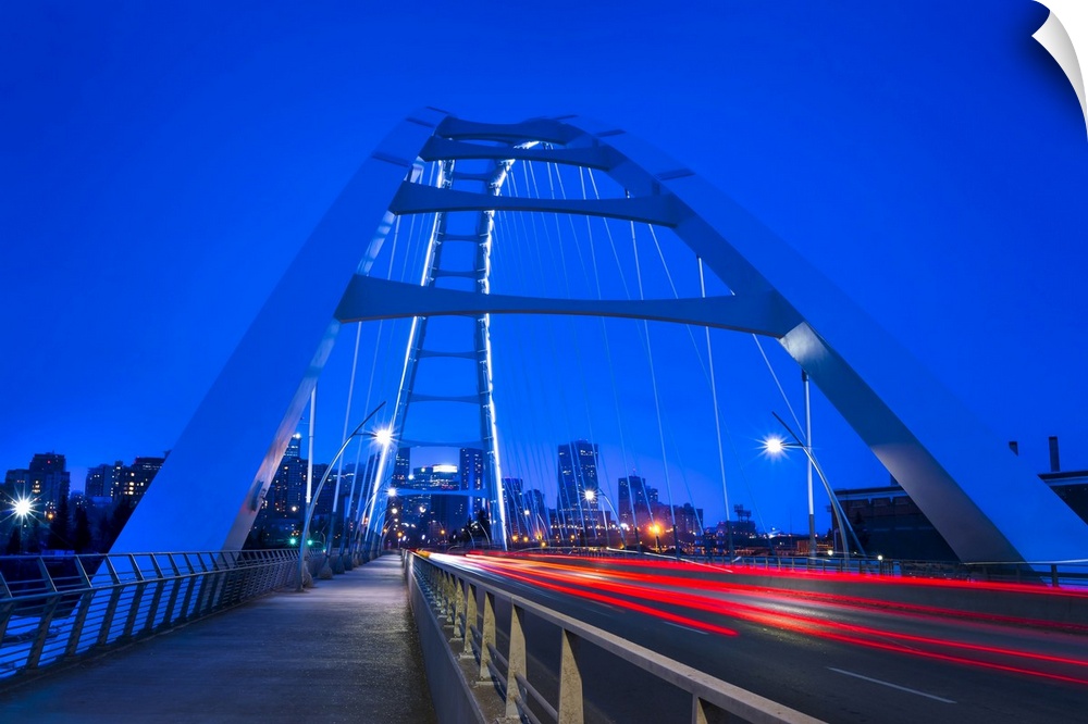 A night shot of the New Walterdale Bridge in downtown Edmonton; Edmonton, Alberta, Canada