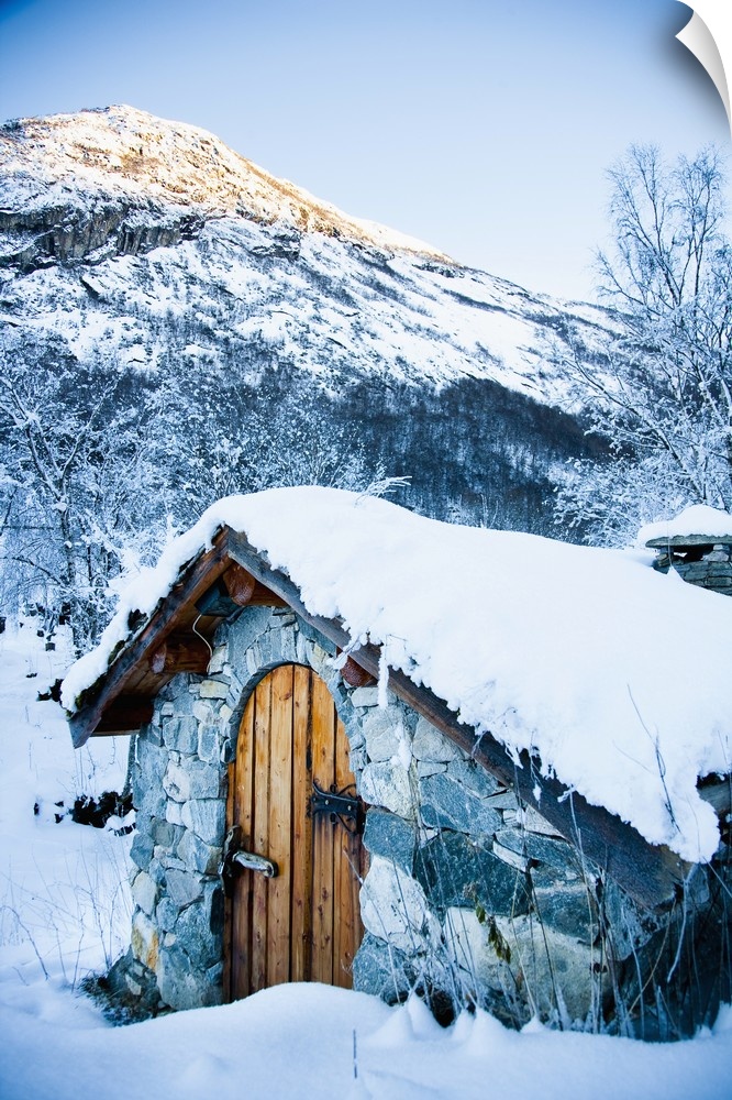 Norway, Sognefjord, snow covered traditional stone building which houses hydro electric generator; Ortnevik, Snowy alpine ...