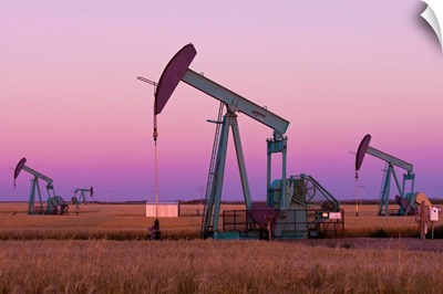 Oil Pump Jacks On Canadian Prairie At Dusk, Carlyle, Saskatchewan, Canada