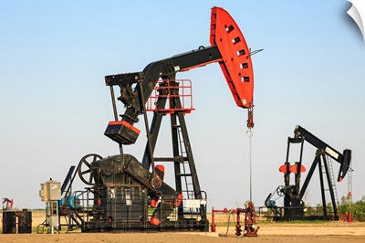 Oil well pump jacks at Bakken Oil Field near Estevan, Saskatchewan, Canada