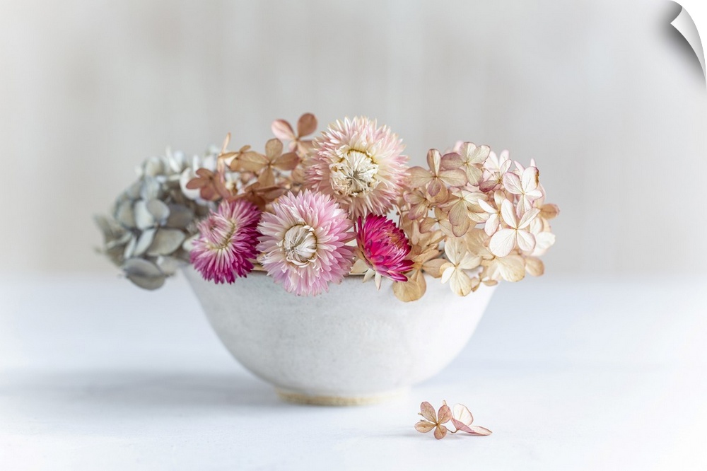 Pastel dried flowers in a bowl.