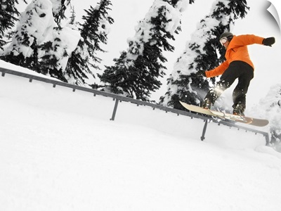 Person Snowboarding On A Railing