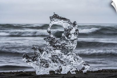 Piece Of Ice On Diamond Beach, Near Jokusarlon, With The Ocean Behind It, Iceland