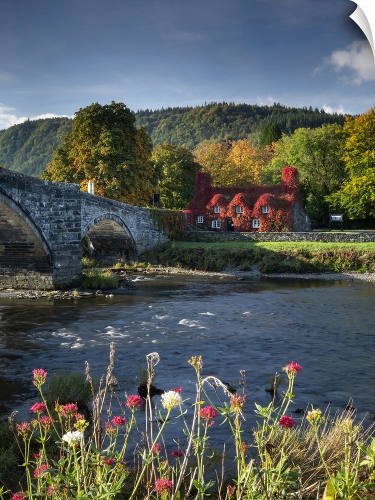 Pont Fawr with Tu Hwnt I'r Bont and the River Conwy at Llanrwst in Snowdonia.