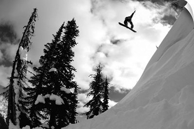 Professional snowboarder makes a big air jump, Canada