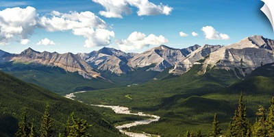 River valley and mountain range with blue sky and clouds, Bragg Creek, Alberta, Canada