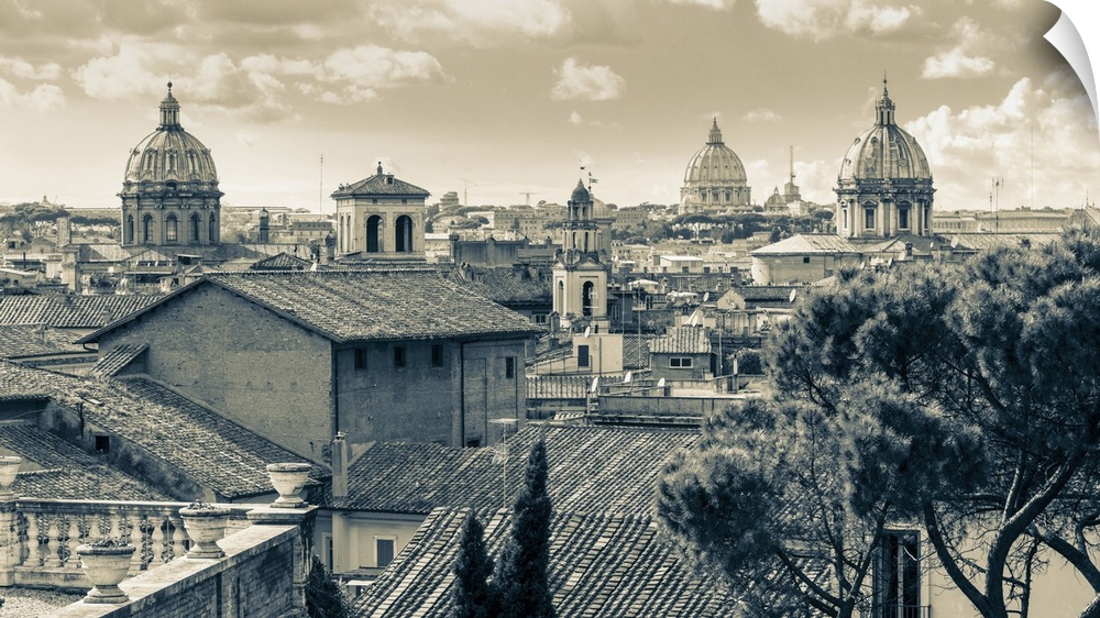 Rome, Italy. Rooftops and domes. In the far distance is St. Peter's. The historic centre of Rome is a UNESCO World Heritag...