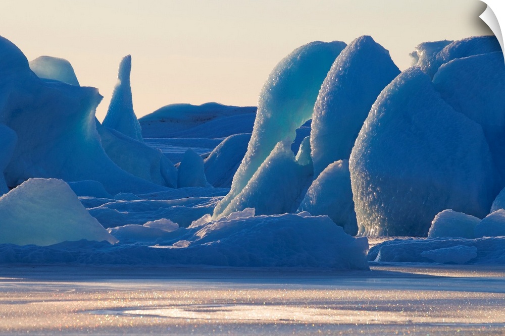 Photograph of huge ice structures.  Some are thin and tall while others are wide and round.