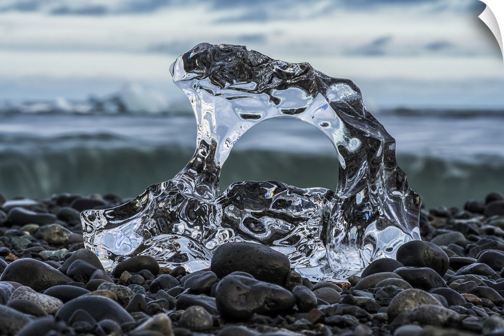 Small piece of melted glacial ice on the shore of the ocean near Jokulsarlon, South Coast of Iceland; Iceland.