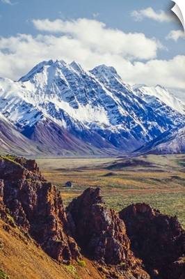 Snow Covered Denali With Rocky Cliffs And Colorful Foliage On The Tundra, Alaska