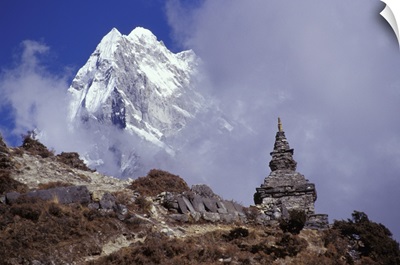 Snow Covered Peak With Nepalese Monument