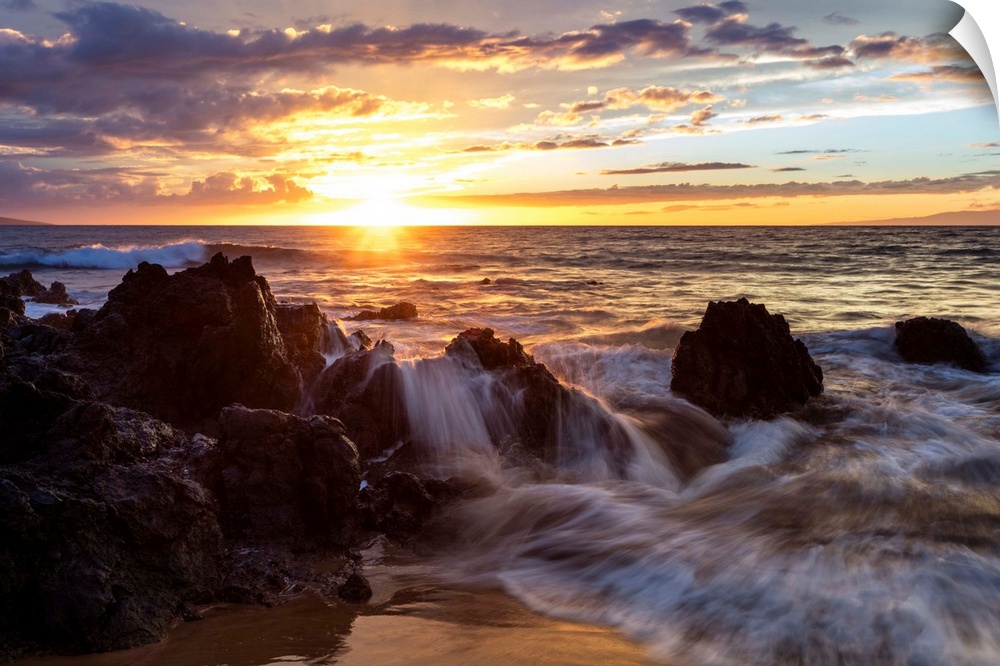 Soft water over lava rocks during sunset; Makena, Maui, Hawaii, United States of America.