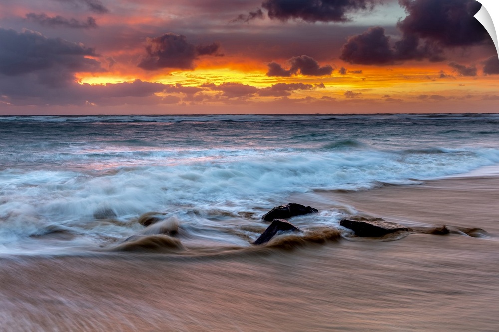 Sunrise on the Hawaiian shore, Lydgate Beach; Kapaa, Kauai, Hawaii, United States of America.
