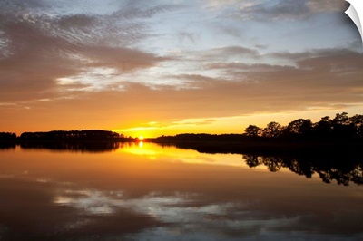 Sunset over a Chesapeake Bay shoreline.; Kent Island, Maryland.