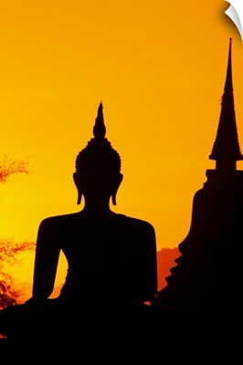 Thailand, Sukhothai, Buddha And Temple Silhouetted At Sunset