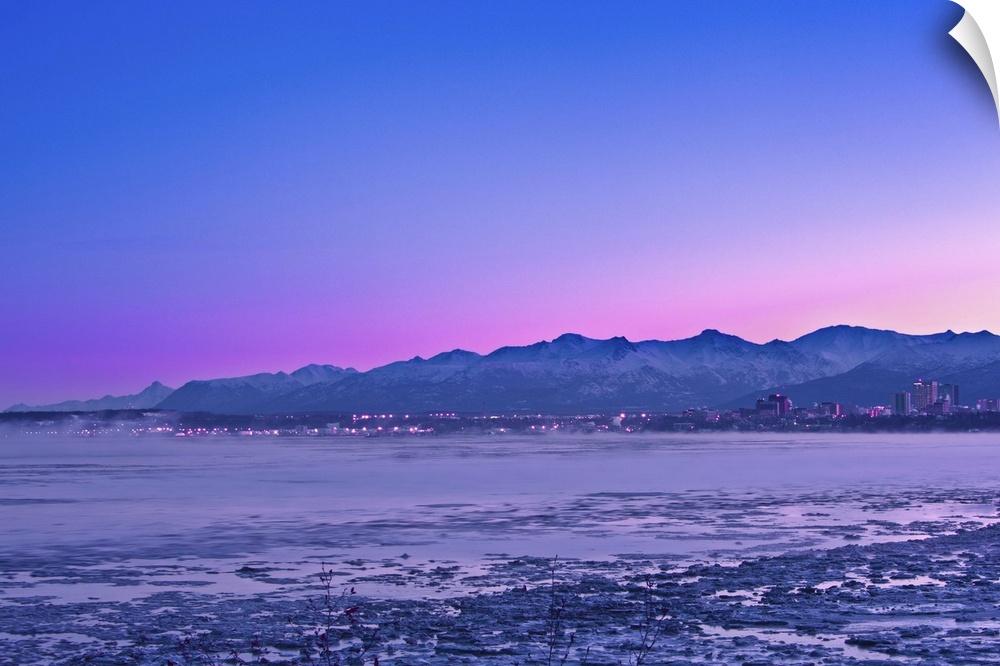 The Anchorage Skyline before dawn with fog rising from the waters of Knik Arm as seen from Earthquake Park, Southcentral, ...