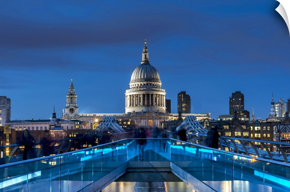The Millennium footbridge and St Paul's Cathedral at night.