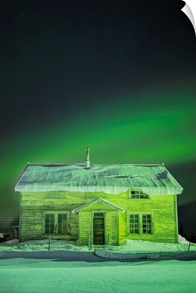 The Northern Lights in the sky above 'Our Lady of the Snows' Catholic Mission Building in winter, Nulato, Interior Alaska,...