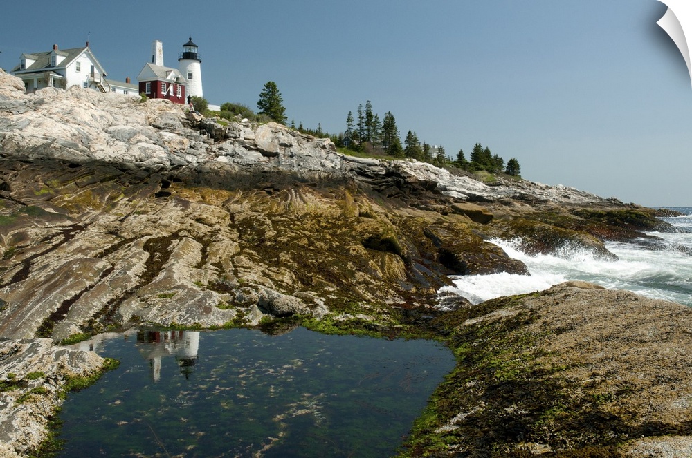 The Pemaquid lighthouse and its reflection in a coastal tidal pool, Pemaquid Point, Maine.