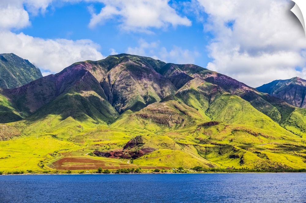 The rugged landscape of the island of Maui under a blue sky with cloud, Maui, Hawaii, United States of America