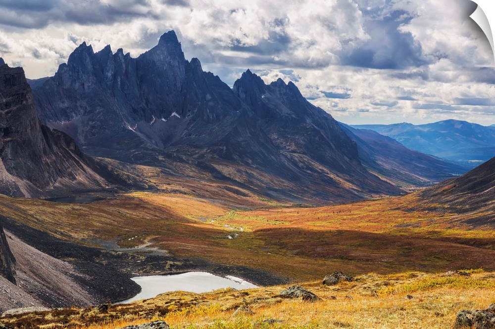 In the Yukon's North country, Tombstone mountain stands out above the tundra and surrrounding landscape. Yukon, Canada.