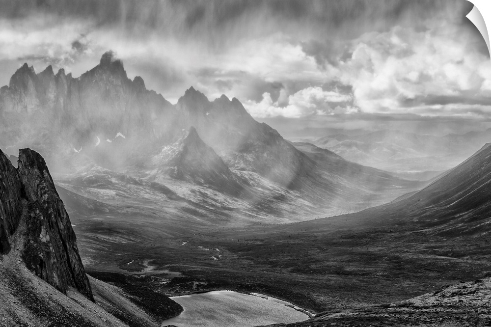 Black and White image of a rain storm over the Tombstone Valley in Tombstone Territorial Park, with Tombstone Mountain shr...