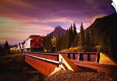 Train Going Over A Bridge; Banff National Park, Alberta, Canada