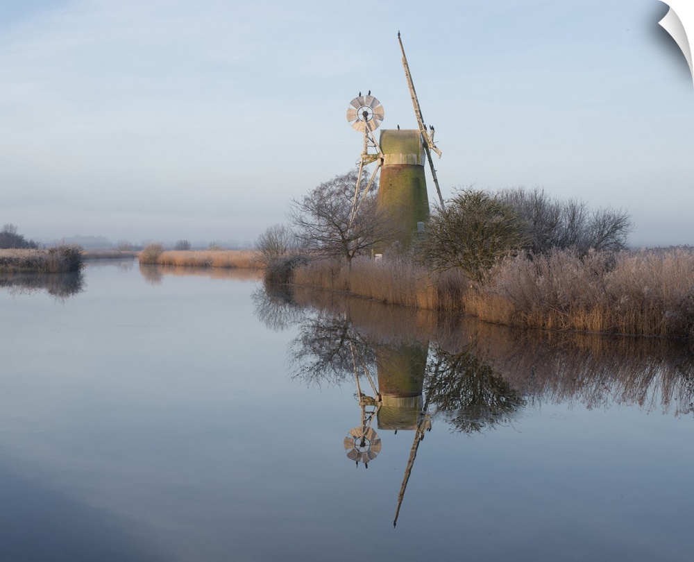 Turf Fen mill reflected in the River Ant at How Hill.