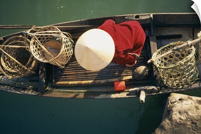 View From Above Of Vietnamese Woman In Conical Hat In A Boat; Vietnam