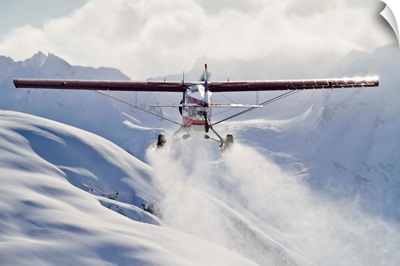 View of a Super Cub air taxi at Tanaina Glacier in the Neacola Mountains, Alaska