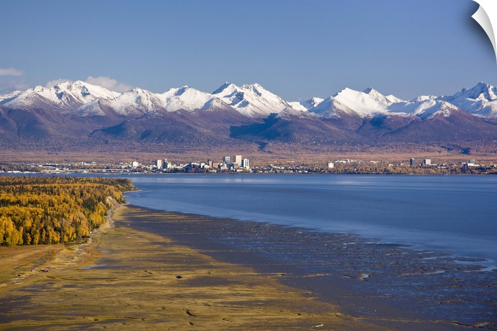 Aerial view of the Anchorage skyline looking southeast from Point Mackenzie over Knik Arm with the Chugach Mountains in th...