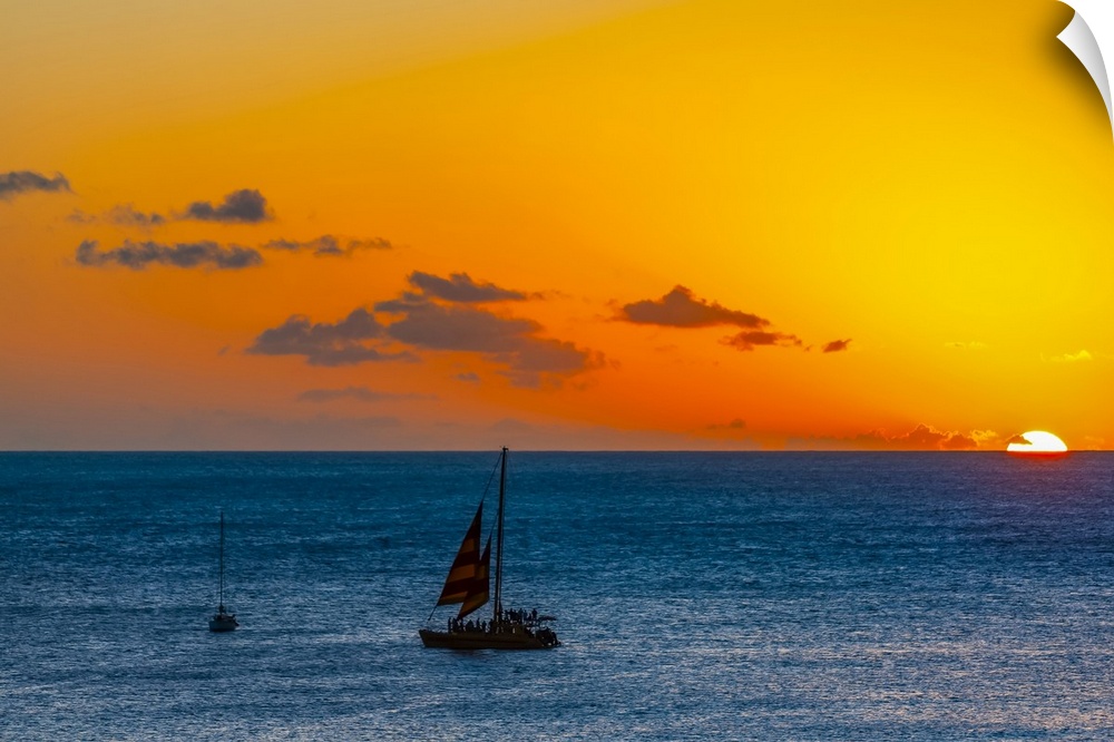Sunset over the ocean with sailboats off Waikiki Beach; Honolulu, Oahu, Hawaii, United States of America