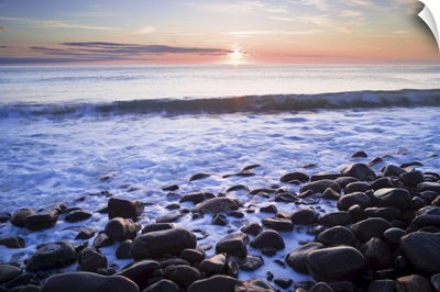 Waves Breaking On Rocky Shore At Dawn, Near Dunstanburgh Castle, Northumberland, England